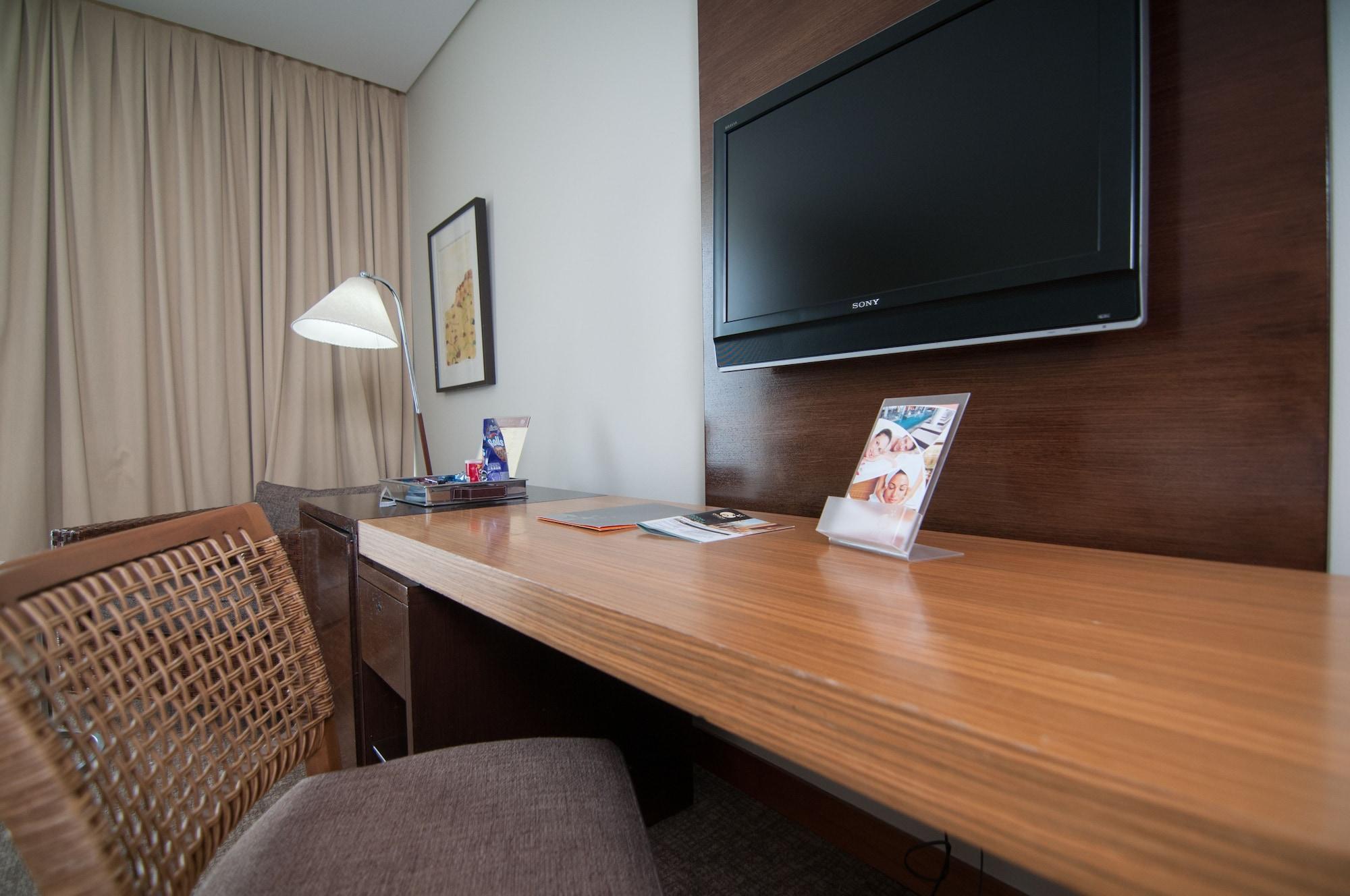 Enjoy Coquimbo Hotel Exterior foto A television in a hotel room